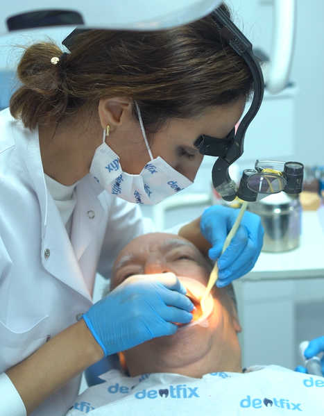 Dr. Ayse Atay performing All-on-4 dental implant procedure